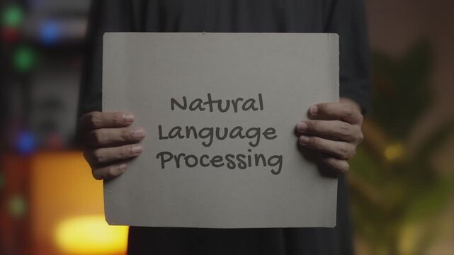 Natural Language Processing Written on Banner &ndash; Man Holding Placard