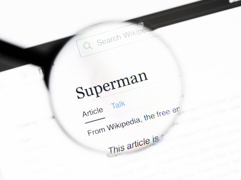 Milan, Italy 2026, 20 Apr Closeup of Superman Wikipedia page on a laptop screen. Superman name under a magnifying glass.