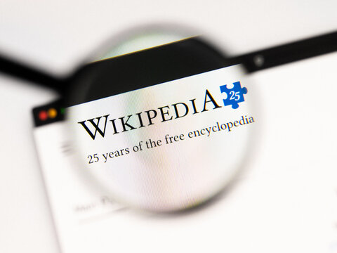 Milan, Italy 2026, 20 Apr Closeup of Wikipedia website on a laptop screen. Wikipedia logo under a magnifying glass.