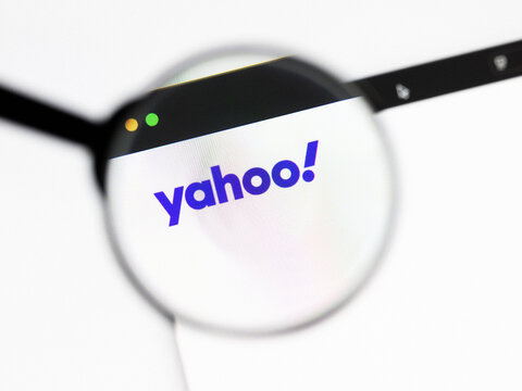 Milan, Italy 2026, 20 Apr Closeup of Yahoo website on a laptop screen. Yahoo logo under a magnifying glass.