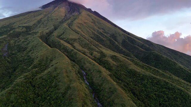 Push in tilt up aerial shot of Mountain Mayon in Albay, Philippines