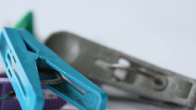 Several old colorful clothespins for hanging clothes on a white background
