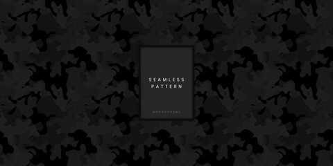 Seamless monochrome camouflage pattern or military woodland camo texture with dark organic shapes on a black background for tactical gear textile design and hunting apparel surface © gegen.Temp