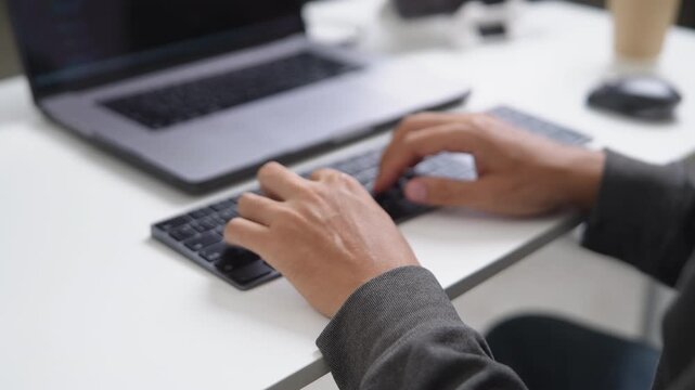 Close-up of Hands Typing on a Keyboard During Remote Work Setup with Technology