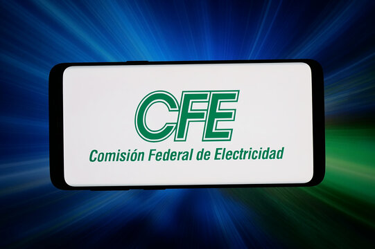 Stuttgart, Germany - 06-05-2026: In this photo illustration, the logo of Comision Federal de Electricidad (CFE) is displayed on a smartphone in front of abstract background on computer screen.