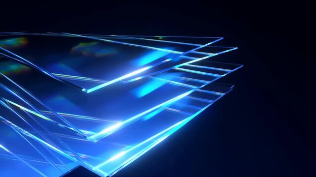 Slow motion panning shot of stacked layered glass panels sliding and rotating in dark studio space with glowing blue reflections