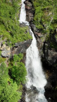 Aerial shot of Meelva Waterfall in northern Norway.  Vertical video.