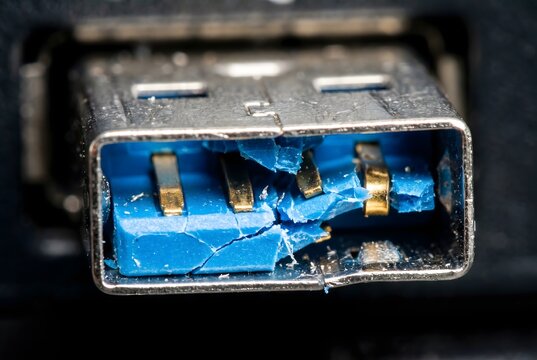 Extreme macro shot of snapped blue plastic inside USB connector