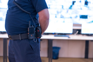 Security Guard with Radio Transceiver in Control Room Close Up © as-artmedia