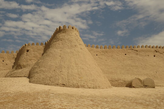 Historic defensive wall of Itchan Kala in the city of Khiva. Uzbekistan. Built with mud bricks and coated with a mixture of mud and straw. World Heritage Site.