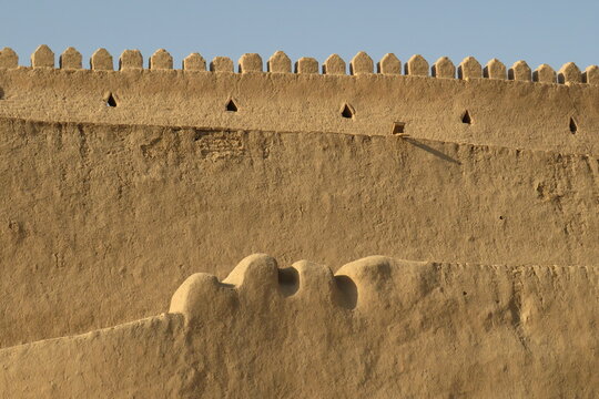 Historic defensive wall of Itchan Kala in the city of Khiva. Uzbekistan. Built with mud bricks and coated with a mixture of mud and straw. World Heritage Site.