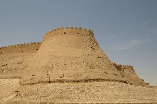 Historic defensive wall of Itchan Kala in the city of Khiva. Uzbekistan. Built with mud bricks and coated with a mixture of mud and straw. World Heritage Site.