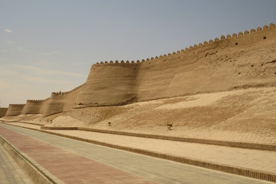 Historic defensive wall of Itchan Kala in the city of Khiva. Uzbekistan. Built with mud bricks and coated with a mixture of mud and straw. World Heritage Site.