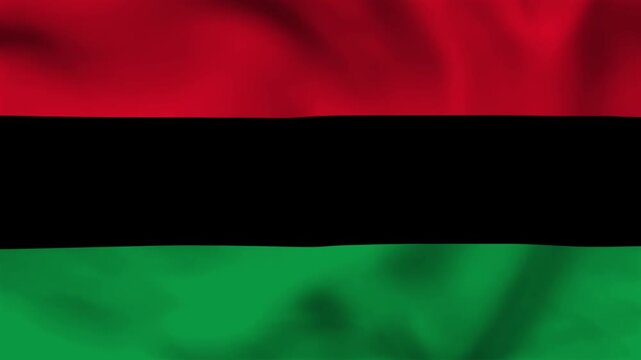 Elegant satin fabric ripples in Pan-African flag colors. Ideal design element for Juneteenth, Black History Month, and cultural pride.