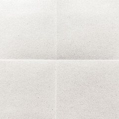 Fototapeta premium Close-up of a textured, blank white paper with subtle creases.