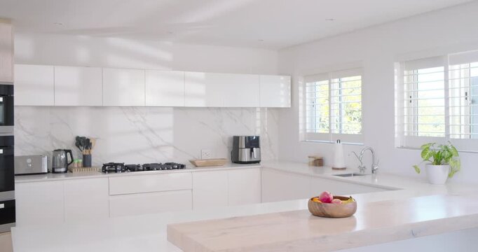 Sunlight through shutters is shifting, camera is moving forward, bringing wooden fruit bowl forward