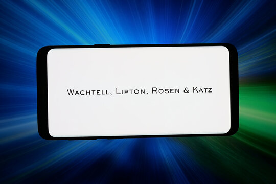 Stuttgart, Germany - 06-05-2026: In this photo illustration, the logo of company Wachtell, Lipton, Rosen and Katz (WLRK is displayed on a smartphone in front of abstract background on computer screen.