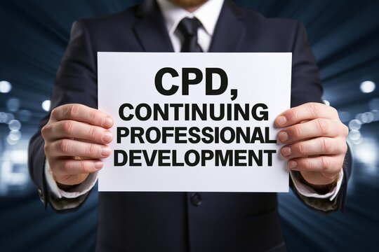 Businessman highlighting cpd continuing professional development sign