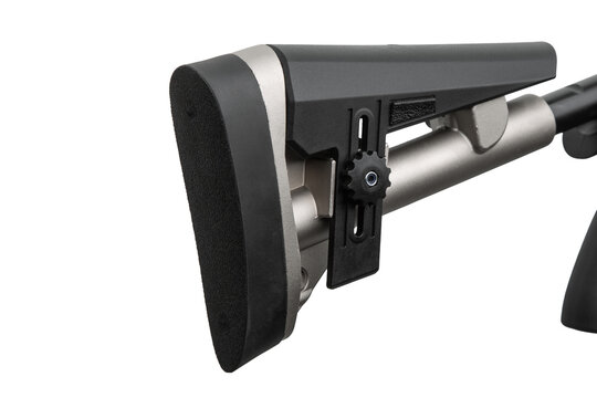 Close-up of an adjustable tactical shotgun buttstock with recoil pad on a white back