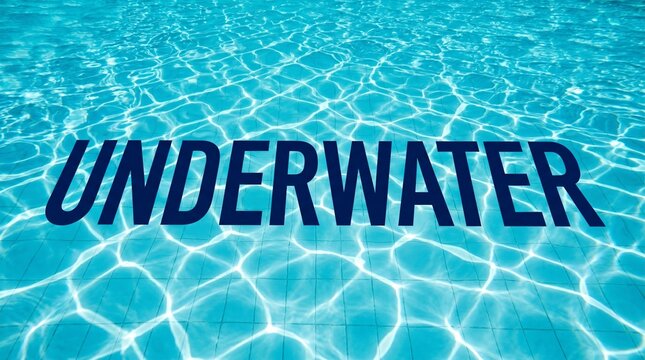 Underwater scene with rippling pool water surface