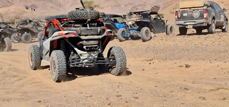 Off-Road Expedition Fleet in Desert with Dune Buggies and 4x4 SUV

