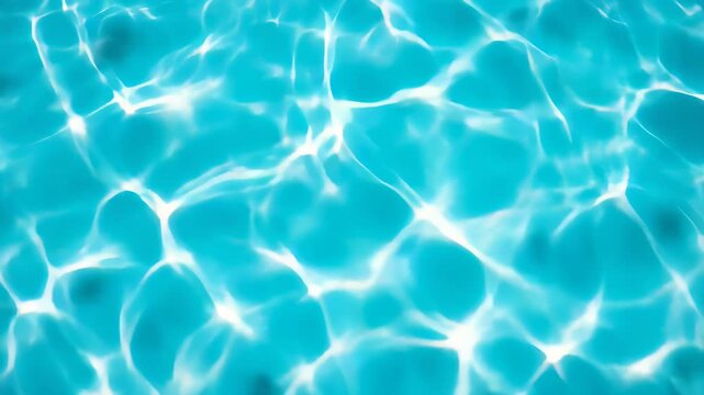 Bright turquoise swimming pool water with white rippled sunlight patterns covering the surface