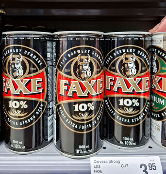 DENIA, SPAIN - January 31, 2026.Large cans of Faxe alcohol extra strong beer on display in a Spanish grocery store showing European beverage options