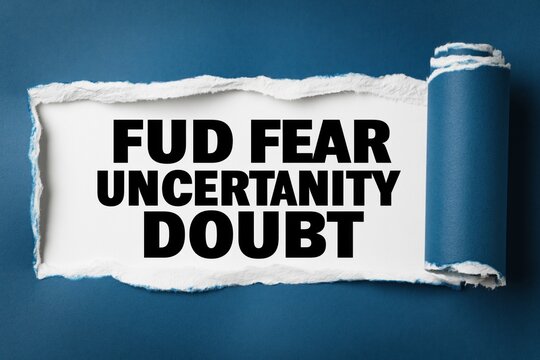 fud fear uncertainty doubt written under a torn blue paper