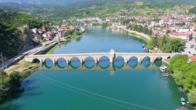Elevated drone view of Mehmed Pasha Sokolovic Bridge and the Drina River in eastern Bosnia