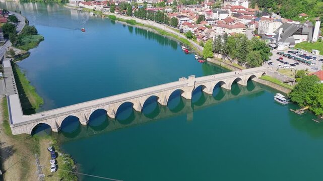 Wide aerial panorama of Mehmed Pasha Sokolovic Bridge and the Drina River waterfront