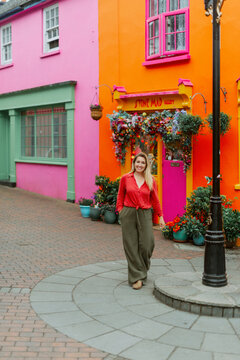 Happy Woman On a Walk Down a Colorful Street in Kinsale County Cork Ireland