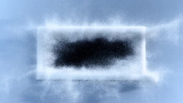 Slow motion overhead shot of white powder particles forming rectangular void on blue surface in studio