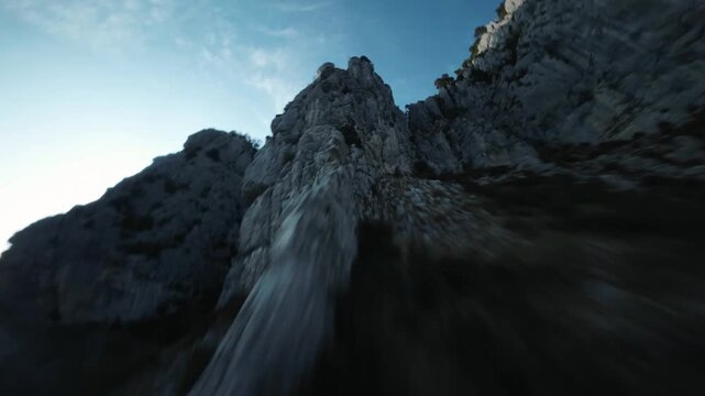 FPV Drone Shot Climbing Fast Towards High Limestone Muntain Peak