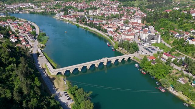 Drone panorama showcasing the historic bridge and urban center of Visegrad along the Drina River
