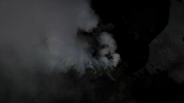 Aerial Top Down View of Active Volcano Crater with Thck Smoke