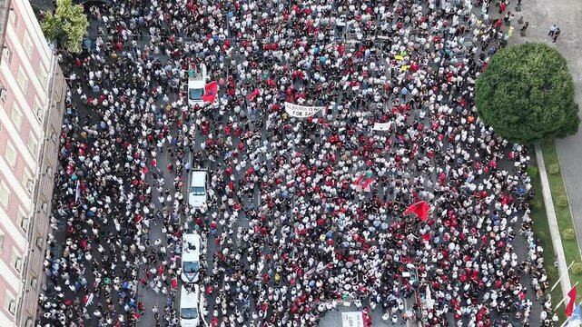 Close Aerial Shot of Dense Protest Crowd in Tirana, about Zvernec case and saving Flamingos, also asking prime minister resignation, day 10 of protest