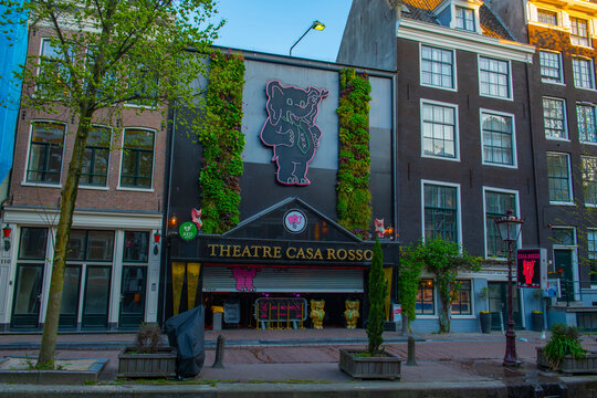 Theatre Casa Rosso on Oudezijds Achterburgwal canal in Red Light District (De Wallen), central Amsterdam, Netherlands. Canal Ring Area of Amsterdam is designed as a UNESCO World Heritage Site.  