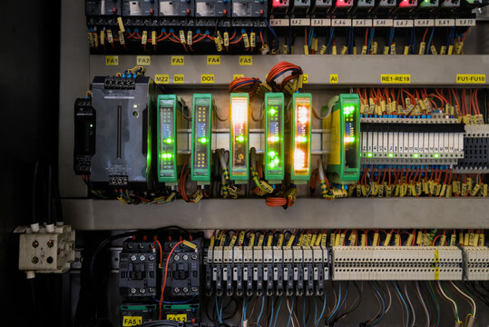 Industrial automation controller rack with flashing signaling lamps showing active data processing network state
