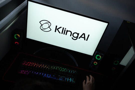 Punta Arenas, Chile &ndash; June 12, 2026: A desktop PC monitor showing the KlingAI artificial intelligence branding on a white background, surrounded by an illuminated gaming keyboard and peripherals