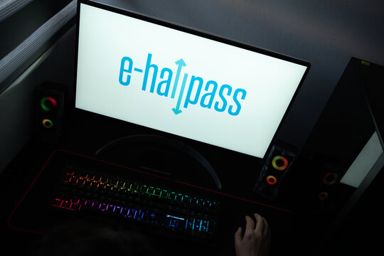 Punta Arenas, Chile &ndash; June 12, 2026: A desktop PC monitor showing the e-hallpass educational software branding, surrounded by an illuminated gaming keyboard and peripherals