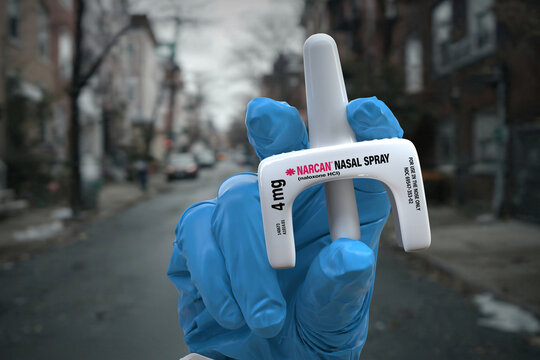 A doctor holds Narcan, a Naloxone nasal spray used for emergency opioid overdose reversal. This product is used in healthcare, addiction treatment, public health, and pharmaceuticals