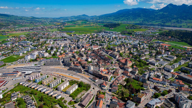 An aerial view beside the city and e old town of Bulle in Switzerland on a sunny noon in spring.