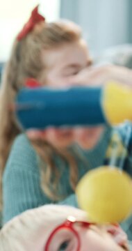 Child, playing and rocket in home for craft, education and homemade for science fair. Kids, liquid and experiment in lounge for diy aerospace, creative activity and outer space for school assignment