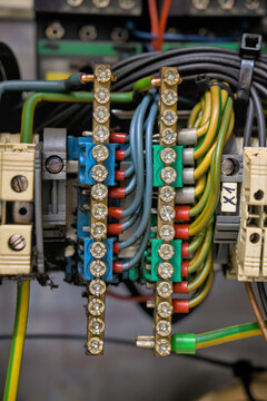 Industrial control panel wiring with terminal blocks and copper busbars