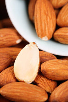 Shelled Almond with Whole Almonds and White Bowl