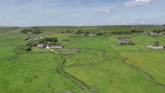 farms and houses surrounded by meadows with grazing sheep in the he hamlet of Colden in the parish of Heptonstall near Hebden Bridge in West yorkshire