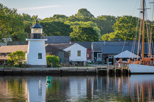 Mystic, Connecticut, USA - Mystic Seaport Lighthouse At Sunrise Along Waterfront Harbor