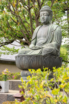 Buddha statue near Senso-ji temple in Tokyo Asakusa neighborhood district