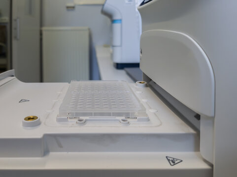 Brussels, Belgium. qPCR instrument with 96 well plate loaded for real time polymerase chain reaction analysis