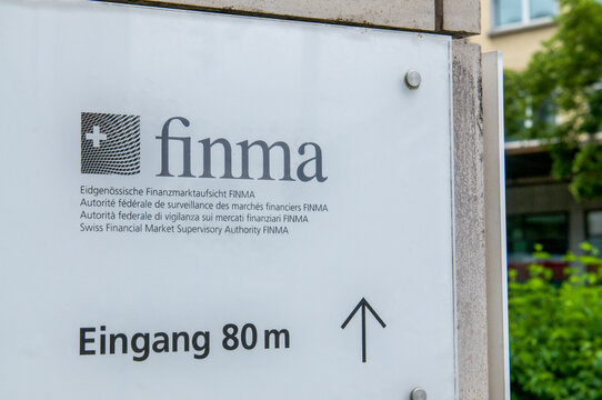 FINMA Swiss Financial Market Supervisory Authority corporate logo sign on a building pillar